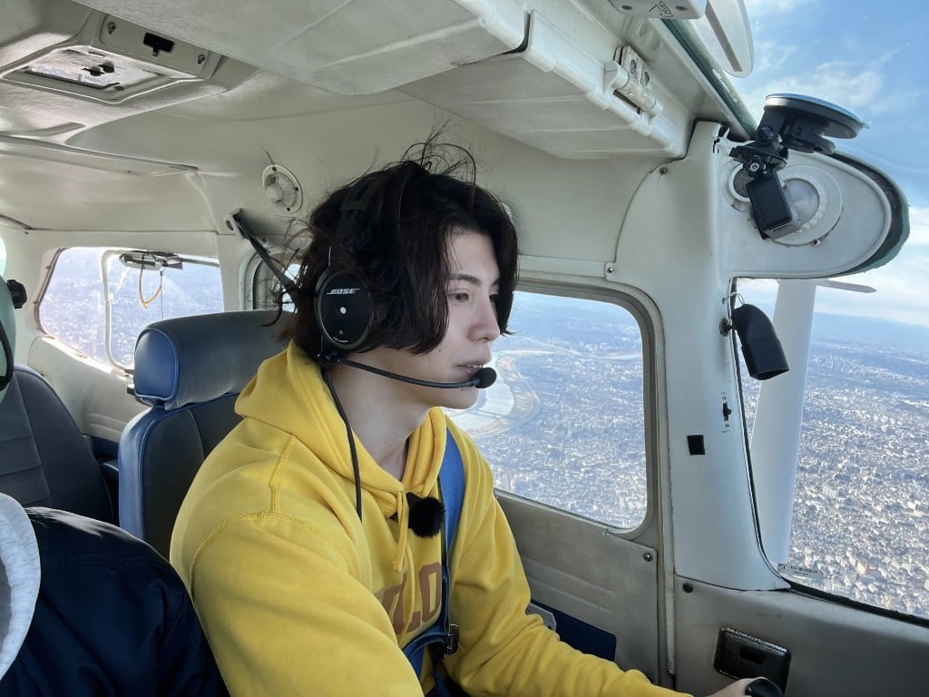 Pilot in the cockpit wearing a headset