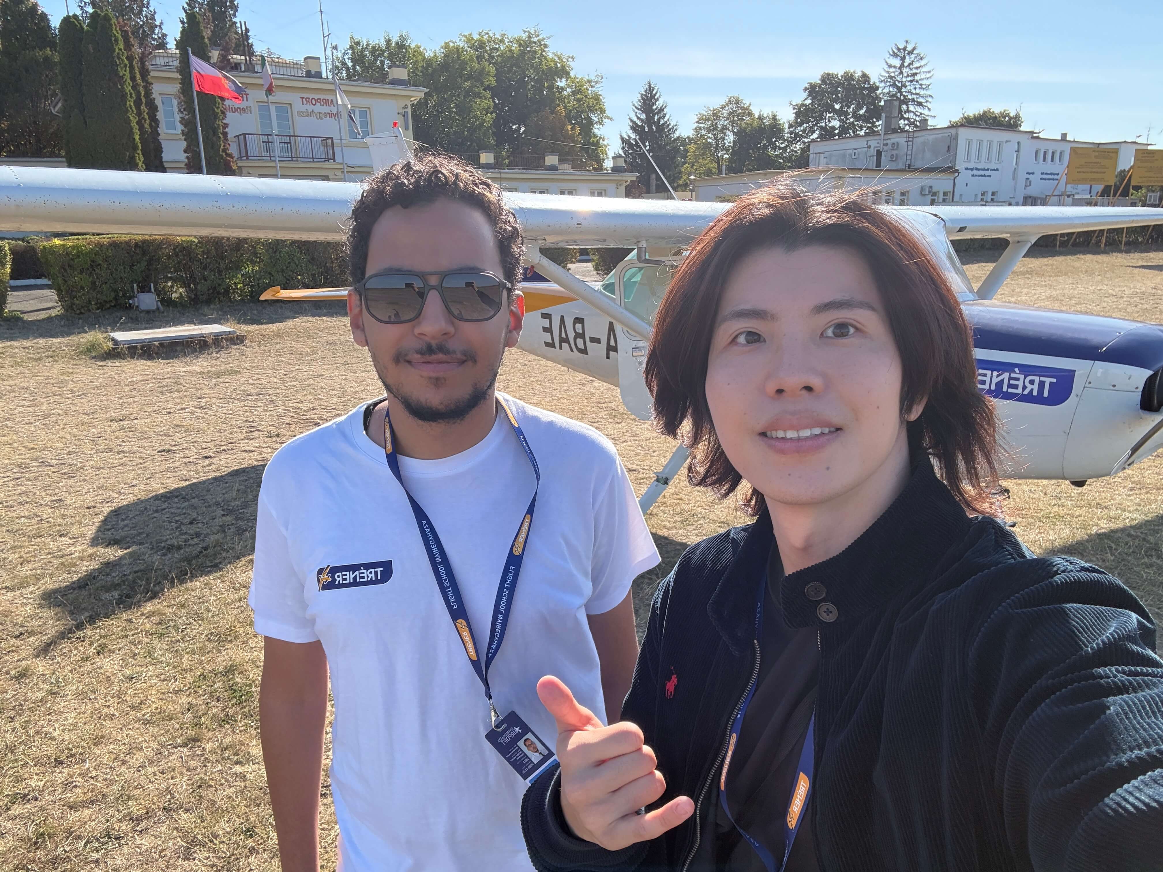 Taisei and a flight instructor beside a training aircraft in Hungary